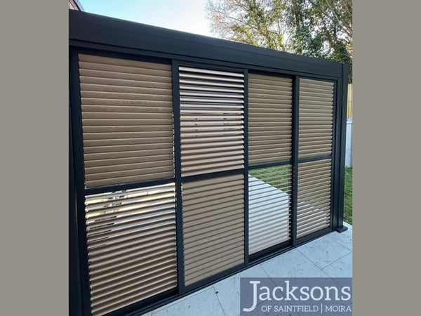 Modern outdoor patio with sliding glass doors and Jacksons branding