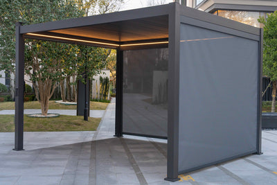 Modern outdoor pergola at Jacksons of Saintfield with a retractable screen in a garden setting